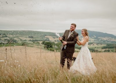 Bride & Groom Popping Champagne | Swansea Wedding